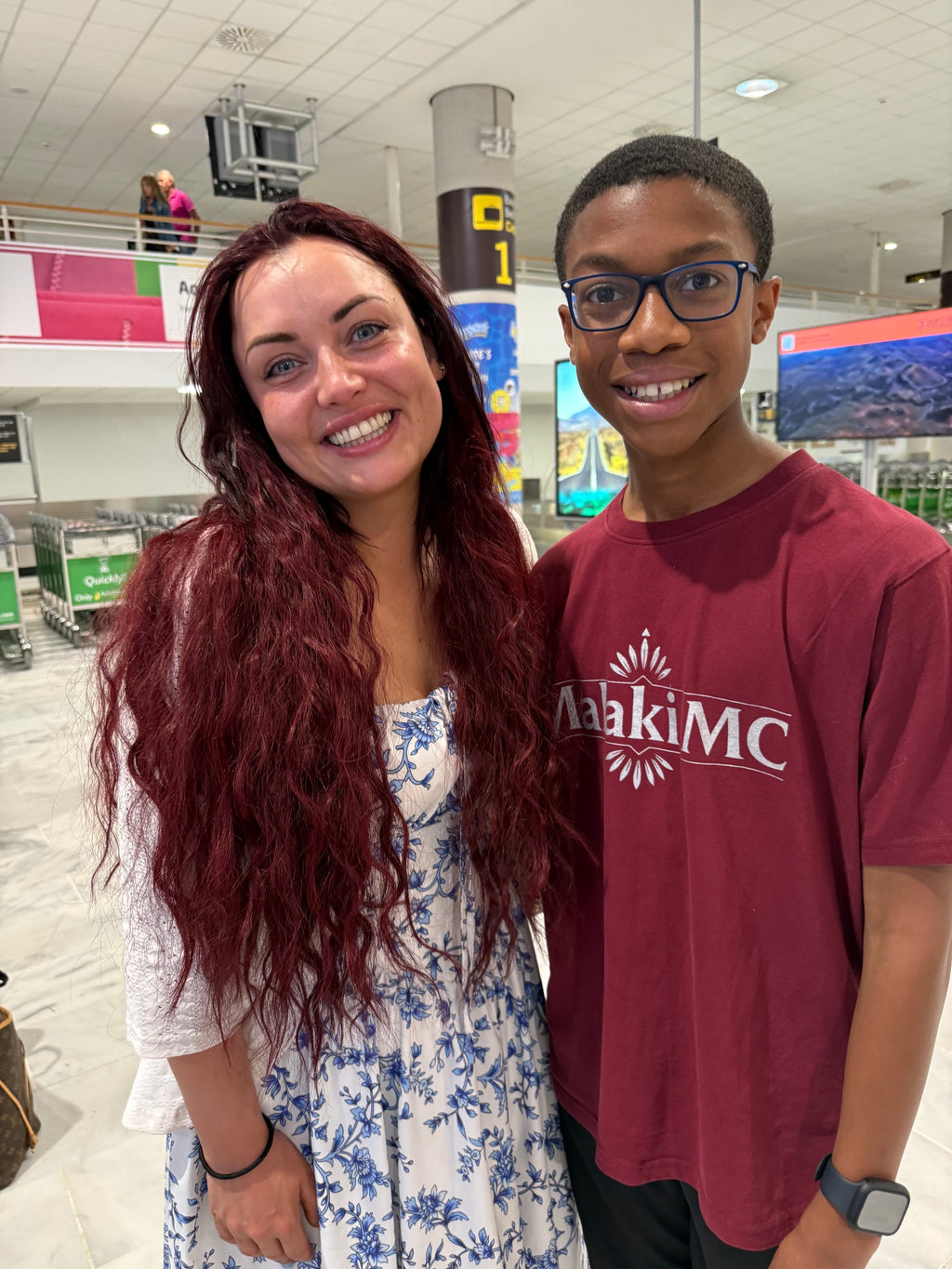 Malaki with Whitney Dean from EastEnders both wearing Malaki MC at the airport