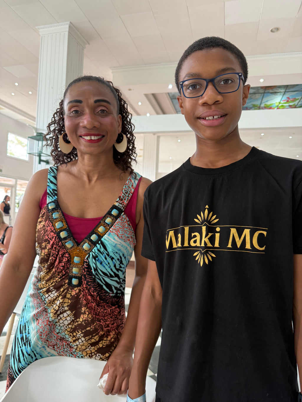 Malaki MC Black T-Shirt lifestyle photo with Malaki and his mum