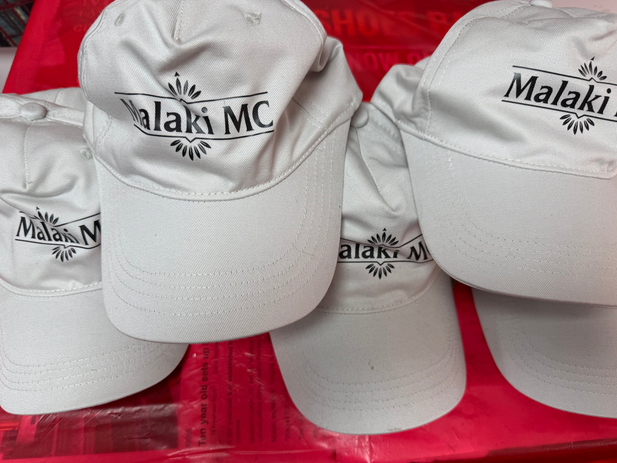 Multiple Malaki MC white branded caps displayed together